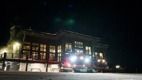 snow cat in front of Sky House