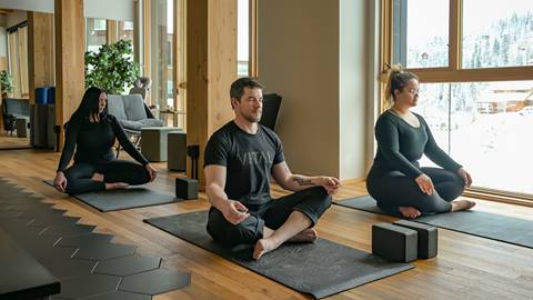 group of people meditating while seated