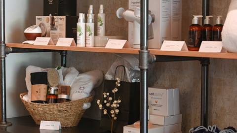 shelves with spa products like lotion and gift baskets