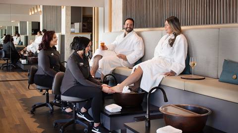 Couple in robes enjoying a foot treatment