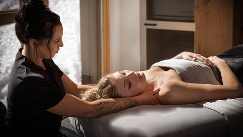 Spa therapist massaging a guest at Cambium Spa