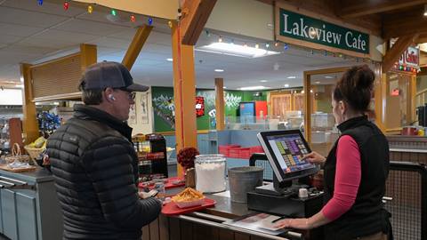 A guest checks out at the Lakeview Cafe register