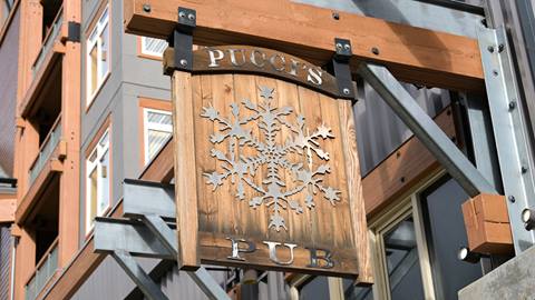 Sign hanging outside Pucci's Bar at Schweitzer