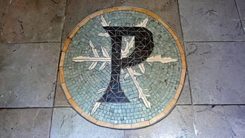 Mosaic tile with Pucci's logo