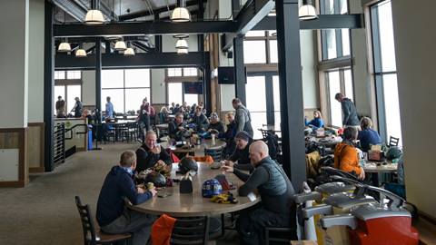 Red Hawk Cafe space with tables and people relaxing