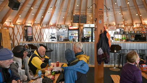 Skiers warming up at the Rowdy Grouse