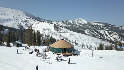 drone image of the yurt with view in the background