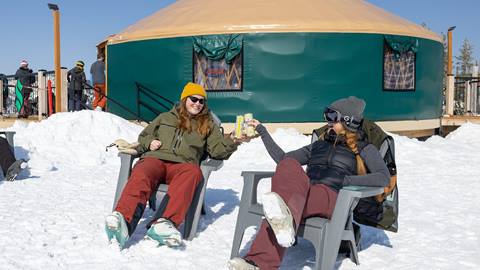 Friends having drinks in the sun next to the Rowdy Grouse