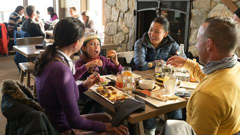 Family enjoying lunch at The Nest restaurant