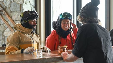 Guests being served drinks at The Nest restaurant