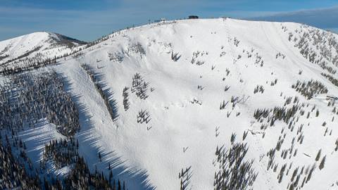 Drone view of steep snowy ski slopes