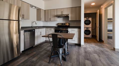 interior of apartment with kitchen and small dining table