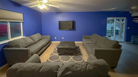 Hemlock House living room with couches and tv