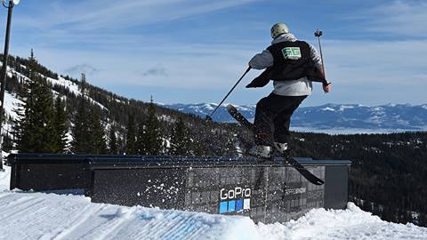 terrain parks crew sliding on rail feature