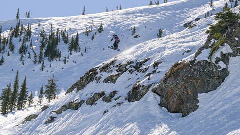 Athlete jumping off a cliff