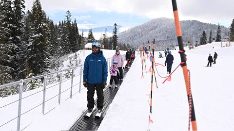 Ski instructor riding Musical Carpet at Schweitzer's beginner area. 