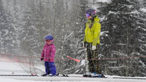 Mother and daughter riding Musical Carpet at Schweitzer.