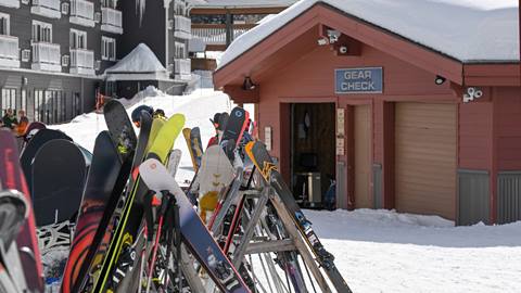 Gear Check sign and some skis in a rack at Schweitzer. 