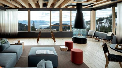 Glass Room in Humbird at Schweitzer with couches, chairs, fireplace, foosball table. 