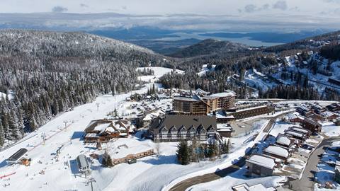 Schweitzer village on a sunny winter day with a view of Sandpoint 