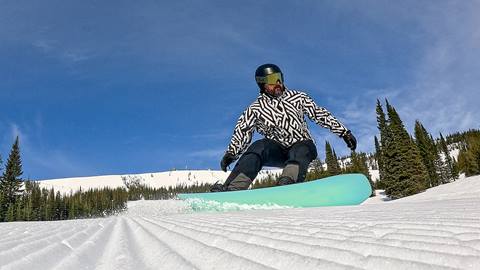 Snowboarder carving cord at Schweitzer