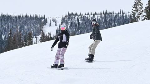 Two snowboarders at Schweitzer