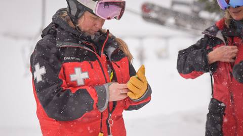 Schweitzer Ski Patrol using their phone and AirFlare app on a snowy day. 