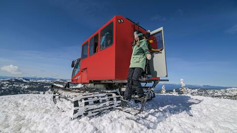 A guest steps out of the snow cat at Schweitzer