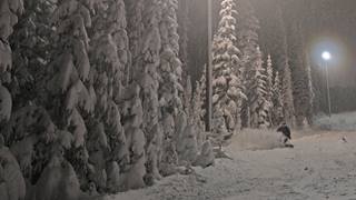 night skiing with snow falling