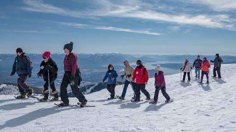 group snowshoe lake view