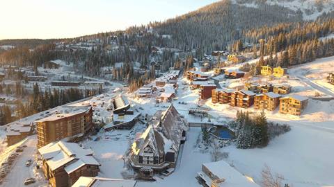 Drone shot of the Schweitzer Village at sunrise.