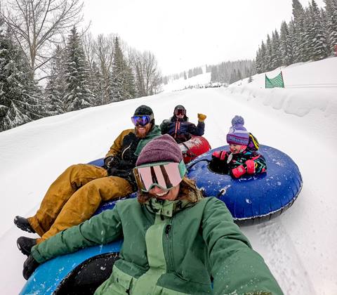 Family snow tubing at Hermit's Hollow Schweitzer Mountain 