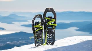 snow shoes with lake in background 