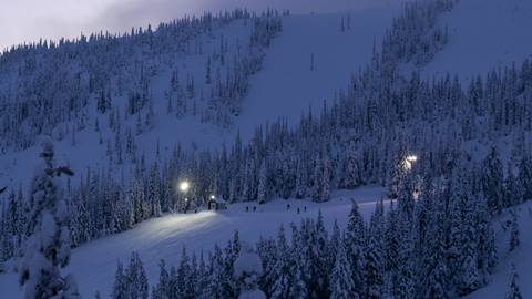 mountain at dusk with lights