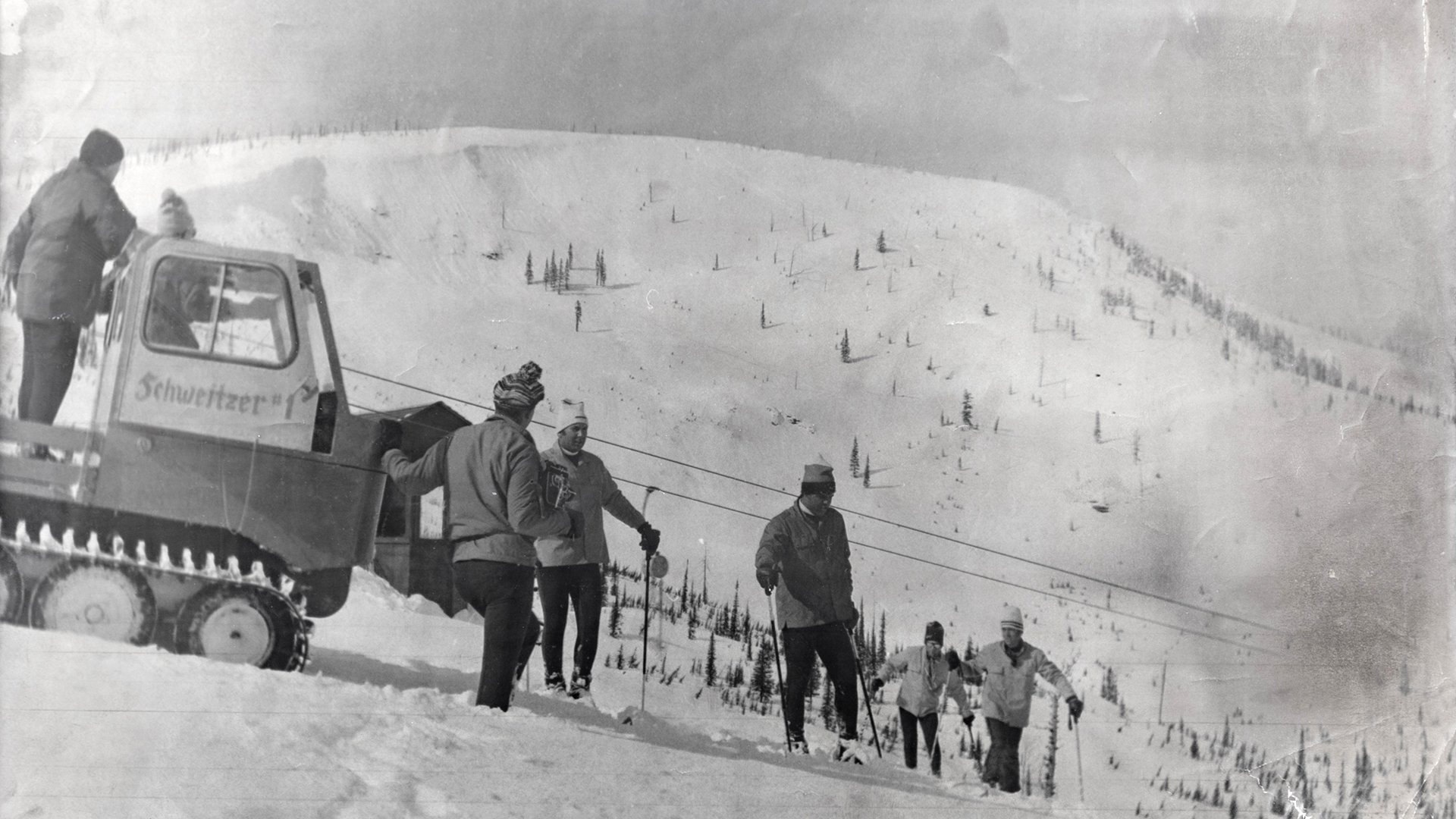 old photo of early schweitzer founders exploring terrain